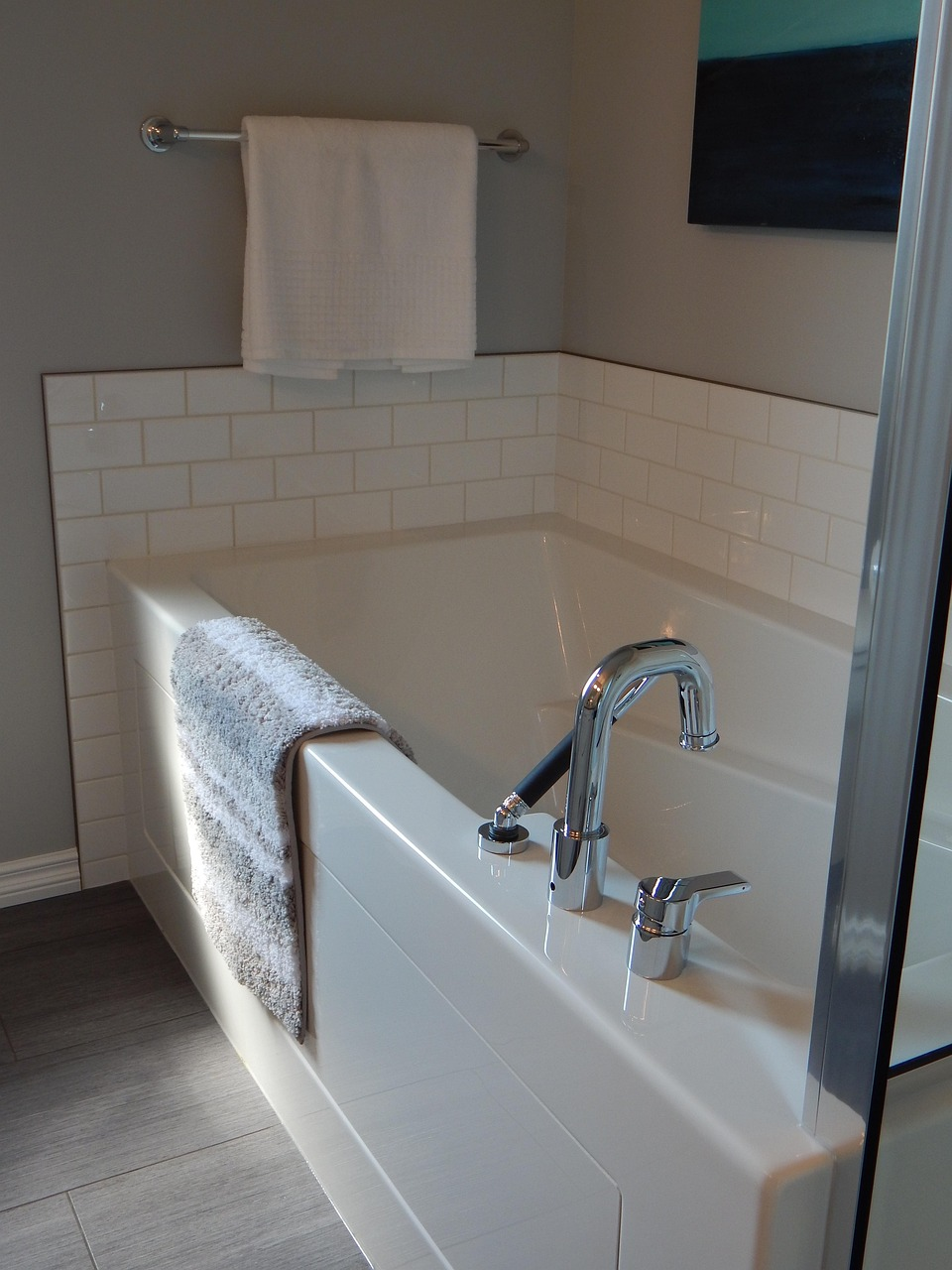 Bright bathroom with a stylish bathtub, tiled walls, and updated fixtures for bathroom remodeling in Republic, MO.